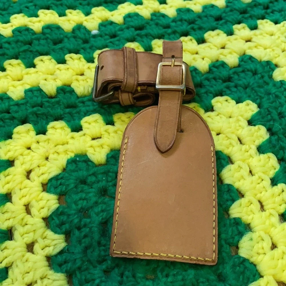 Louis Vuitton luggage tag and poignant
